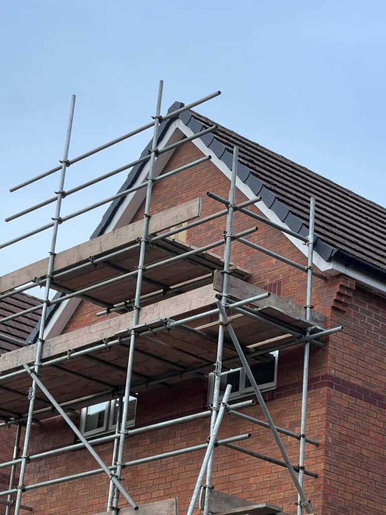 This is a photo of a roof which has just been repaired. There is a scaffold located at the gable end for access onto the roof. Works carried out by Heanor Roofing Repairs